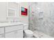 Contemporary bathroom with a single vanity, toilet and a walk-in shower at 219 South Seaside Dr., Surfside Beach, SC 29575