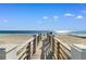 Private boardwalk to beach with gate access at 219 South Seaside Dr., Surfside Beach, SC 29575