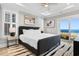 Main bedroom with ocean views, king-size bed, and private balcony access at 219 South Seaside Dr., Surfside Beach, SC 29575