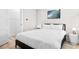 Cozy bedroom with a full-size bed, minimalist decor, and ample natural light at 219 South Seaside Dr., Surfside Beach, SC 29575