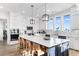 Modern kitchen with white cabinets and large island at 219 South Seaside Dr., Surfside Beach, SC 29575