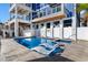 Inviting private pool with lounge chairs and a hot tub at 219 South Seaside Dr., Surfside Beach, SC 29575