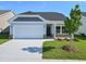 One story home with gray siding and a two car garage at 2441 Campton Loop, Conway, SC 29527