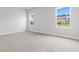 Well-lit bedroom with neutral carpeting and windows offering natural light at 2472 Campton Loop, Conway, SC 29527