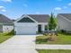 New construction home with stone accents and a two-car garage at 2472 Campton Loop, Conway, SC 29527