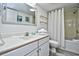 Clean bathroom with white vanity and tub shower at 2711 S Ocean Blvd. # 1522, North Myrtle Beach, SC 29582