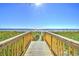 Wooden boardwalk leads to sandy beach at 2711 S Ocean Blvd. # 1522, North Myrtle Beach, SC 29582