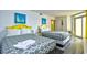Bedroom with two twin beds and yellow accents at 2711 S Ocean Blvd. # 1522, North Myrtle Beach, SC 29582