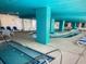 Indoor pool and hot tub area with lounge chairs at 2711 S Ocean Blvd. # 1522, North Myrtle Beach, SC 29582