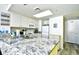 Well-equipped kitchen featuring granite countertops and white cabinets at 2711 S Ocean Blvd. # 1522, North Myrtle Beach, SC 29582