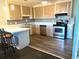 Kitchen with stainless steel appliances, light cabinets, and breakfast bar at 305 Resort Dr. # E-19, Myrtle Beach, SC 29588