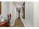 Bright hallway with tiled floor and wall art at 311 2Nd Ave. N # 201, North Myrtle Beach, SC 29582