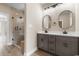 Elegant bathroom with dual vanities, large mirrors, and a glass shower at 3329 Hughes Gasque Rd., Aynor, SC 29511