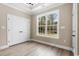 Well-lit bedroom with double doors and a large window at 3329 Hughes Gasque Rd., Aynor, SC 29511