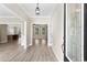 Bright and spacious entryway with hardwood floors and views into the living room and kitchen at 3329 Hughes Gasque Rd., Aynor, SC 29511