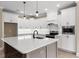 Modern kitchen featuring white cabinets, a sizable island, and stainless steel appliances at 3329 Hughes Gasque Rd., Aynor, SC 29511