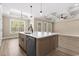 Open-concept kitchen with an island, stainless steel appliances, and a view into the living room at 3329 Hughes Gasque Rd., Aynor, SC 29511