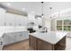 Spacious kitchen with white cabinets, large island, and stainless steel appliances at 3329 Hughes Gasque Rd., Aynor, SC 29511