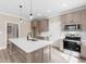 Modern kitchen with island, stainless steel appliances, and white quartz countertops at 3329 Hughes Gasque Rd., Aynor, SC 29511