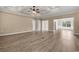 Spacious living area with hardwood floors, tray ceiling, and access to other rooms at 3329 Hughes Gasque Rd., Aynor, SC 29511