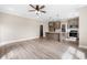 Open living room and kitchen with wood-look flooring at 3329 Hughes Gasque Rd., Aynor, SC 29511