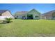 Home's backyard with green lawn and white fence at 333 Basswood Ct., Conway, SC 29526