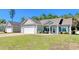 Light taupe house with a white garage door, nicely landscaped yard, and a covered porch at 333 Basswood Ct., Conway, SC 29526