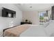 Bright bedroom featuring a large TV and comfortable bed at 3604 Farmington Pl., Myrtle Beach, SC 29579