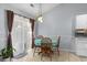 Small dining area with round table and four chairs, near sliding door at 3604 Farmington Pl., Myrtle Beach, SC 29579