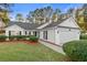 White house with gray roof, two-car garage, and landscaped lawn at 3604 Farmington Pl., Myrtle Beach, SC 29579