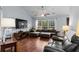 Open living area with sectional sofa, hardwood floors, and large window at 3604 Farmington Pl., Myrtle Beach, SC 29579