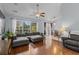 Living room with sectional sofa, hardwood floors, and access to backyard at 3604 Farmington Pl., Myrtle Beach, SC 29579