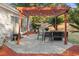 Relaxing patio area with pergola, seating, and fire pit at 3604 Farmington Pl., Myrtle Beach, SC 29579