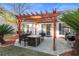 Cozy patio with pergola, fire pit, and seating area at 3604 Farmington Pl., Myrtle Beach, SC 29579