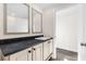 Bathroom features a vanity with dark countertop and mirrors at 3641 Wayside Rd., Conway, SC 29527