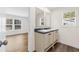 Elegant bathroom with double vanity, dark countertop and a view into bedroom at 3641 Wayside Rd., Conway, SC 29527