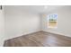 Bright bedroom featuring wood-look floors and a large window at 3641 Wayside Rd., Conway, SC 29527
