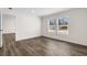 Well-lit bedroom with wood-look floors and access to another room at 3641 Wayside Rd., Conway, SC 29527