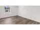 Bright bedroom with wood-look floors and large window at 3641 Wayside Rd., Conway, SC 29527