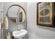 Powder room with pedestal sink and decorative wall art at 517 Harbison Circle, Myrtle Beach, SC 29588