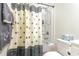 Bathroom with tub shower and patterned curtain at 523 Botany Loop # 523, Murrells Inlet, SC 29576