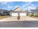 Two-car garage with driveway and manicured landscaping at 523 Botany Loop # 523, Murrells Inlet, SC 29576