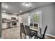 Kitchen dining area with glass-top table and black chairs at 5630 Rosewood Dr., Myrtle Beach, SC 29588