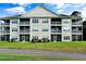 Building's back exterior with balconies at 6010 Windsor Green Way # 301, Myrtle Beach, SC 29579