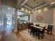 Bright dining room with hardwood floors and chandelier at 620 Sunnyside Dr. # 102, Murrells Inlet, SC 29576