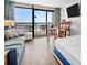 Ocean view bedroom with a full-size bed and dining area at 6804 Ocean Blvd. # 331, Myrtle Beach, SC 29572