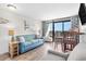 Living room with ocean view, sofa, and dining table at 6804 Ocean Blvd. # 331, Myrtle Beach, SC 29572