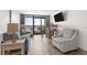 Living room with ocean view, sofa, and dining table at 6804 Ocean Blvd. # 331, Myrtle Beach, SC 29572