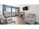 Living room with ocean view, sofa, and dining area at 6804 Ocean Blvd. # 331, Myrtle Beach, SC 29572