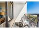 Enjoy ocean views from this balcony with chairs and a table at 6804 Ocean Blvd. # 331, Myrtle Beach, SC 29572